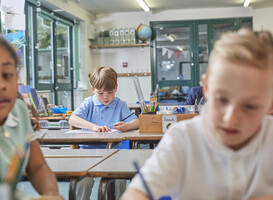 Normal_focused-child-studying-in-a-classroom-environment-2024-06-27-20-51-07-utc